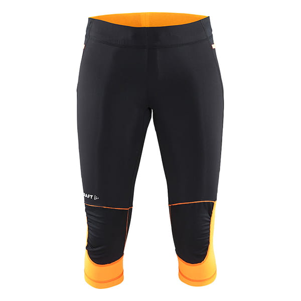 Kalhoty Craft W Kalhoty Trail Capri černá s oranžovou